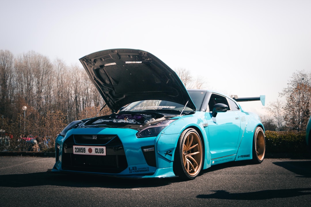 a-blue-sports-car-with-its-hood-open-c1l87m723ze